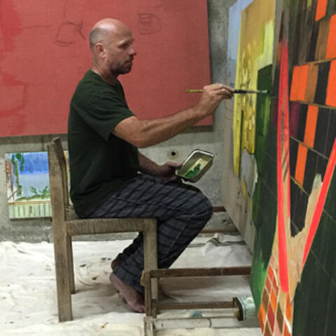 Photo of man in painting studio